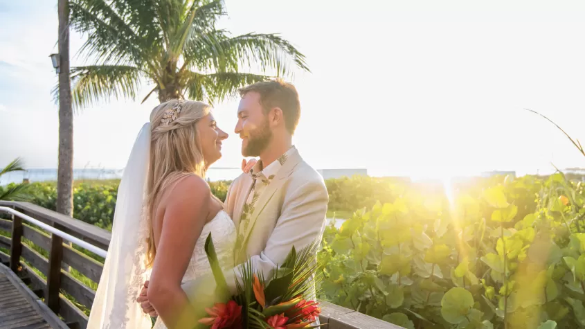 just married on beach, palm tree