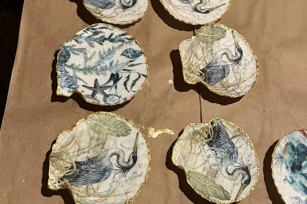 shells with patterns decoupaged on the inside and golf around the rim
